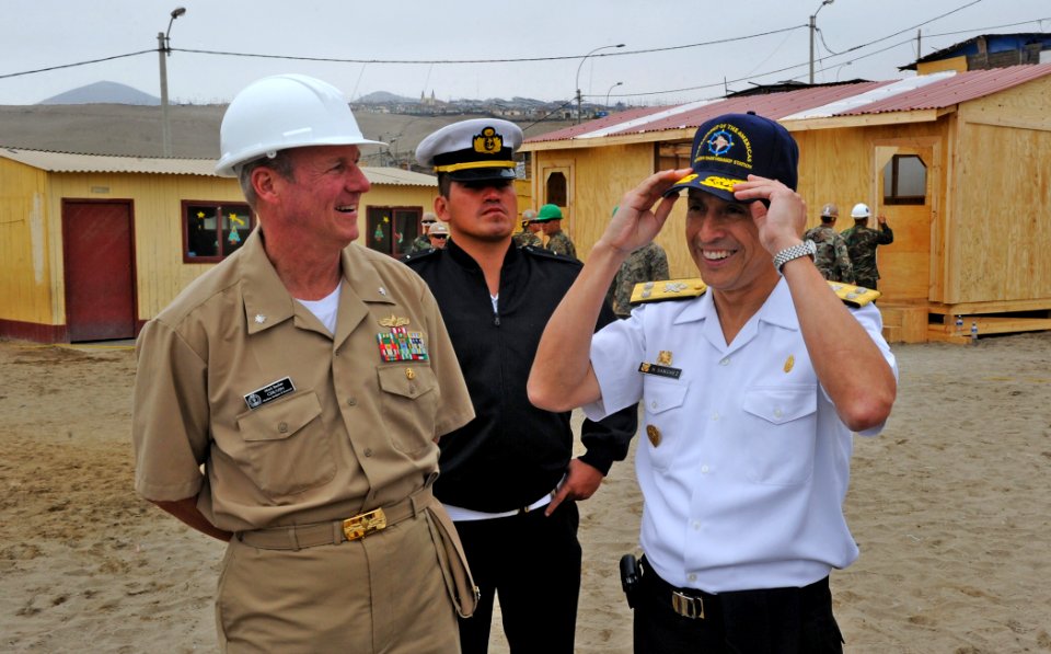 US Navy 101214-N-7589W-258 Cmdr. Mark Becker, mission commander of Southern Partnership Station (SPS) 2011, shares a laugh