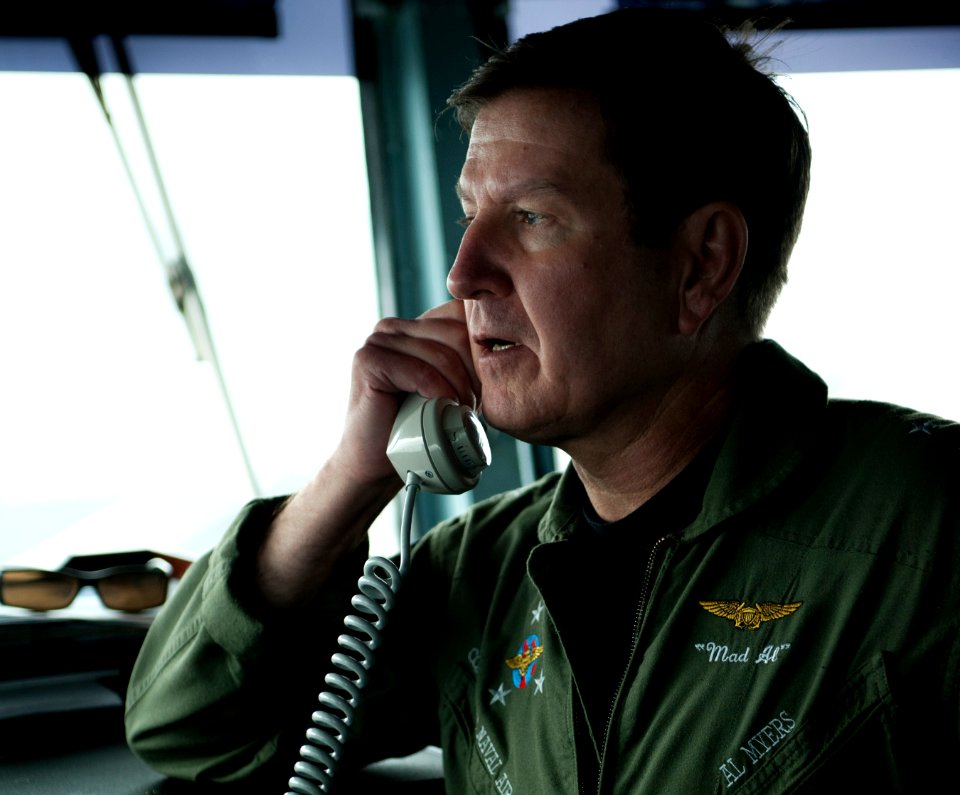 US Navy 101214-N-7981E-502 Vice Adm. Allen G. Myers addresses the crew over the 1MC announcement system from the bridge of USS Carl Vinson (CVN 70)