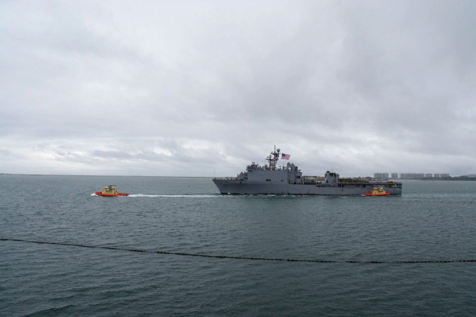 US Navy 101218-N-9643K-286 The amphibious dock landing ship USS Pearl Harbor (LSD 52) passes under the Coronado Bridge as the ship returns to Naval