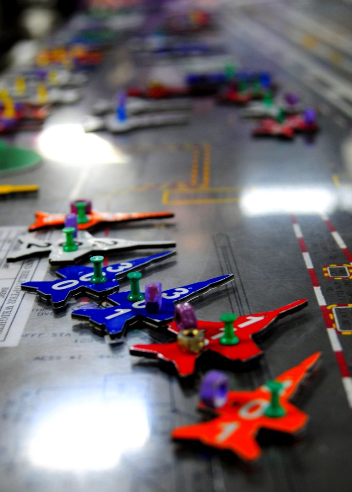 US Navy 101219-N-2953W-028 Sailors position aircraft markers on the Ouija board during a simulated general quarters drill aboard USS Carl Vinson (C