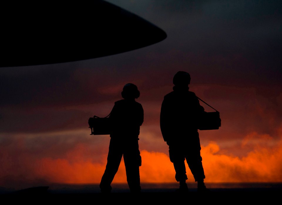 US Navy 101215-N-7981E-541 Sailors assigned to V-2 Division of the air department of the aircraft carrier USS Carl Vinson (CVN 70) stand by to disp