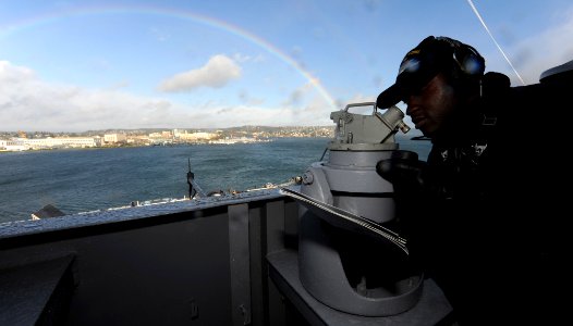 US Navy 101214-N-2475A-041 Quartermaster Seaman James Brown, from Minneapolis, takes bearings on the island of the Nimitz-class aircraft carrier US