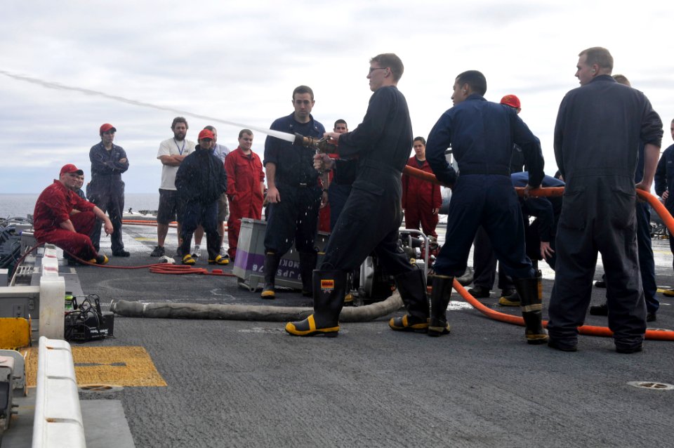 US Navy 101214-N-4378P-212 ailors demonstrate firefighting techniques to USS Peleliu (LHA-5).embarked Tigers aboard
