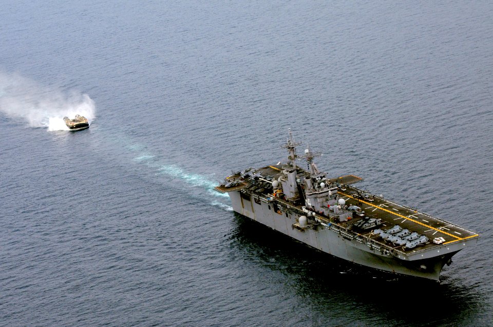 US Navy 101215-N-6552M-232 A landing craft air cushion (LCAC) approaches the amphibious assault ship USS Boxer (LHD 4) for docking. Boxer