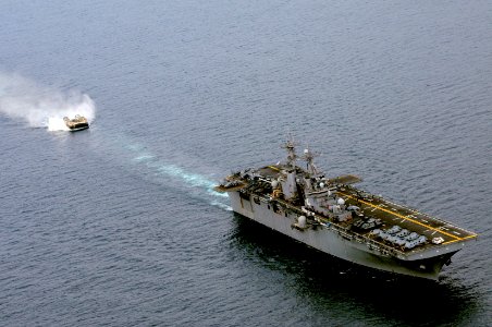 US Navy 101215-N-6552M-232 A landing craft air cushion (LCAC) approaches the amphibious assault ship USS Boxer (LHD 4) for docking. Boxer