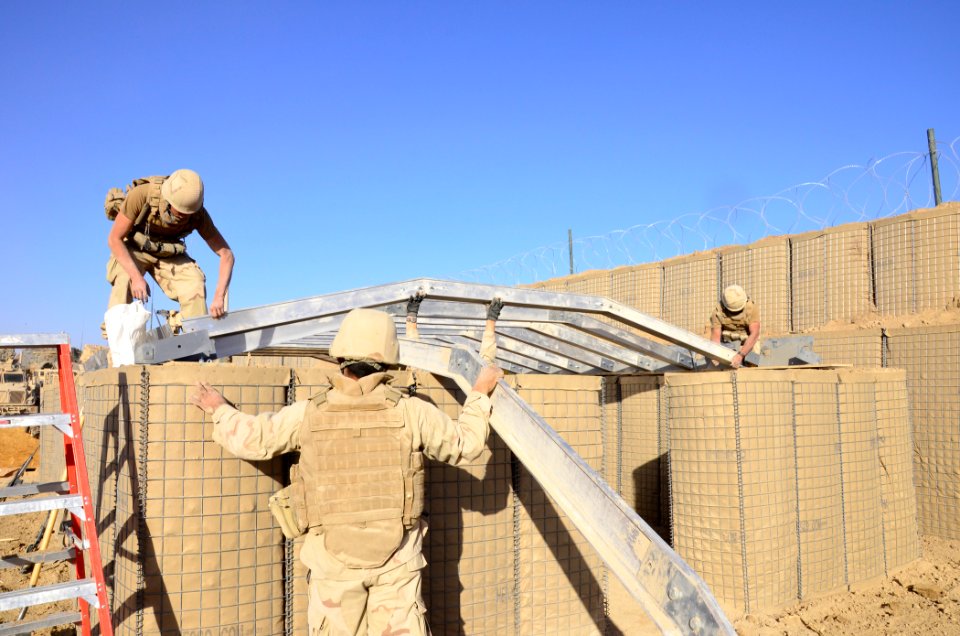 US Navy 101218-N-6436W-136 Active duty and reserve component Seabees assigned to Naval Mobile Construction Battalions 40, 18 and 26 secure and fort