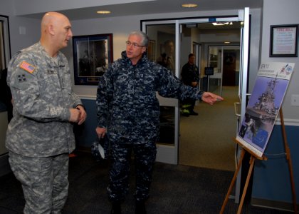 US Navy 101214-N-6764G-020 Vice Adm. Daniel P. Holloway, left, commander of U.S. 2nd Fleet, explains an upcoming U.S. 2nd Fleet Maritime Headquarte