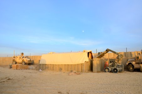 US Navy 101219-N-6436W-009 Active duty and reserve component Seabees assigned to Naval Mobile Construction Battalions 40, 18 and 26 secure and fort