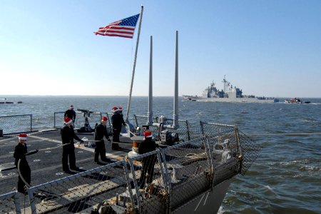 US Navy 101220-N-5292M-469 Sailors aboard the guided-missile destroyer USS Ross (DDG 71) tie the ship to the pier