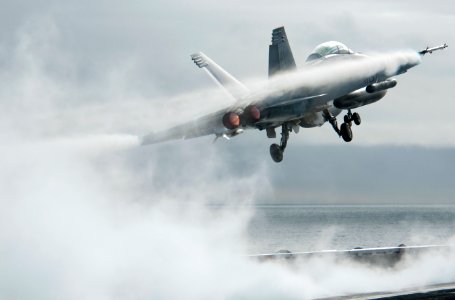 US Navy 101217-N-7981E-171 An F-A-18F Super Hornet assigned to Strike Fighter Squadron (VFA) 22 launches from the flight deck of the aircraft carr