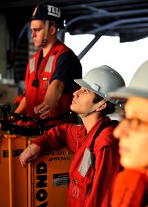 US Navy 101216-N-5016P-070 Aviation Ordnanceman Airman Geoffrey Martinez stands by during a replenishment at sea aboard USS Abraham Lincoln (CVN 72