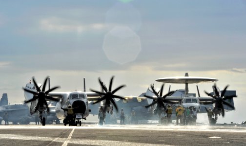 US Navy 101218-N-6003P-086 A C-2A Greyhound assigned to the Rawhides of Fleet Logistics Support Squadron (VRC) 40 and an E-2C Hawkeye