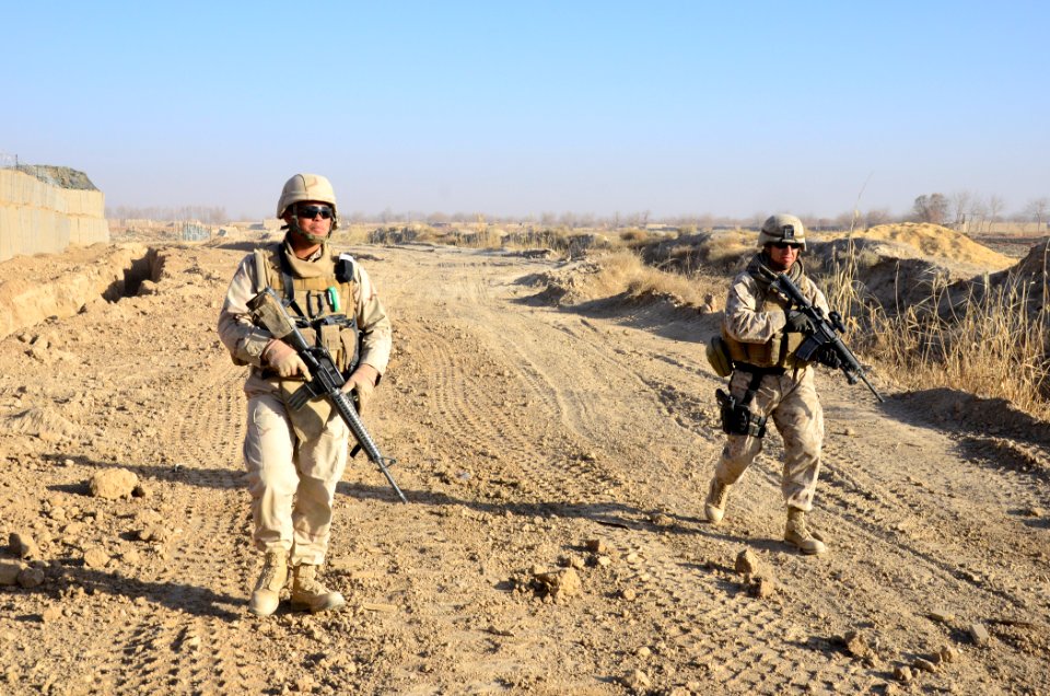 US Navy 101218-N-6436W-037 Builder 1st Class Steven Maldonado and Gunnery Sgt. Javier Vega, both assigned to Naval Mobile Construction Battalion (N