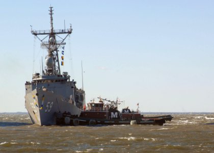 US Navy 101223-N-5292M-037 The guided-missile frigate USS Kauffman (FFG 59) returns to Naval Station Norfolk after a six-month deployment to the U photo
