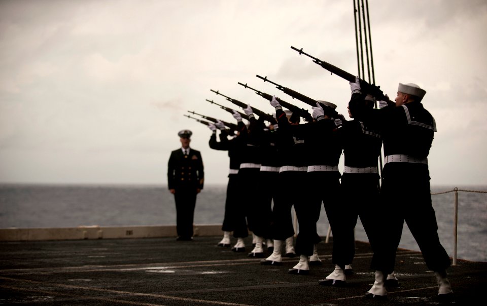 US Navy 101227-N-7981E-214 A rifle platoon fires three volleys during a burial at sea aboard USS Carl Vinson (CVN 70)
