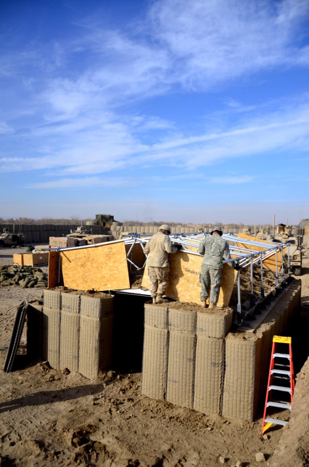 US Navy 101219-N-6436W-005 Active duty and reserve component Seabees assigned to Naval Mobile Construction Battalions 40, 18 and 26 secure and fort