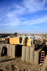 US Navy 101219-N-6436W-005 Active duty and reserve component Seabees assigned to Naval Mobile Construction Battalions 40, 18 and 26 secure and fort