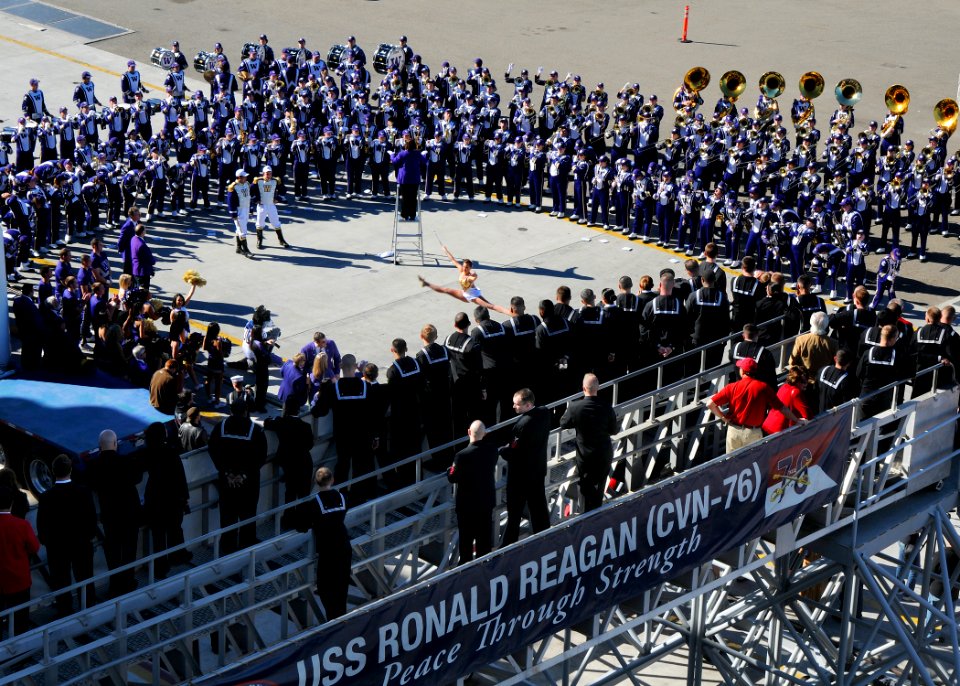 US Navy 101228-N-1004S-251 The University of Washington marching band performs for Sailors in front of USS Ronald Reagan (CVN 76) during a battle o