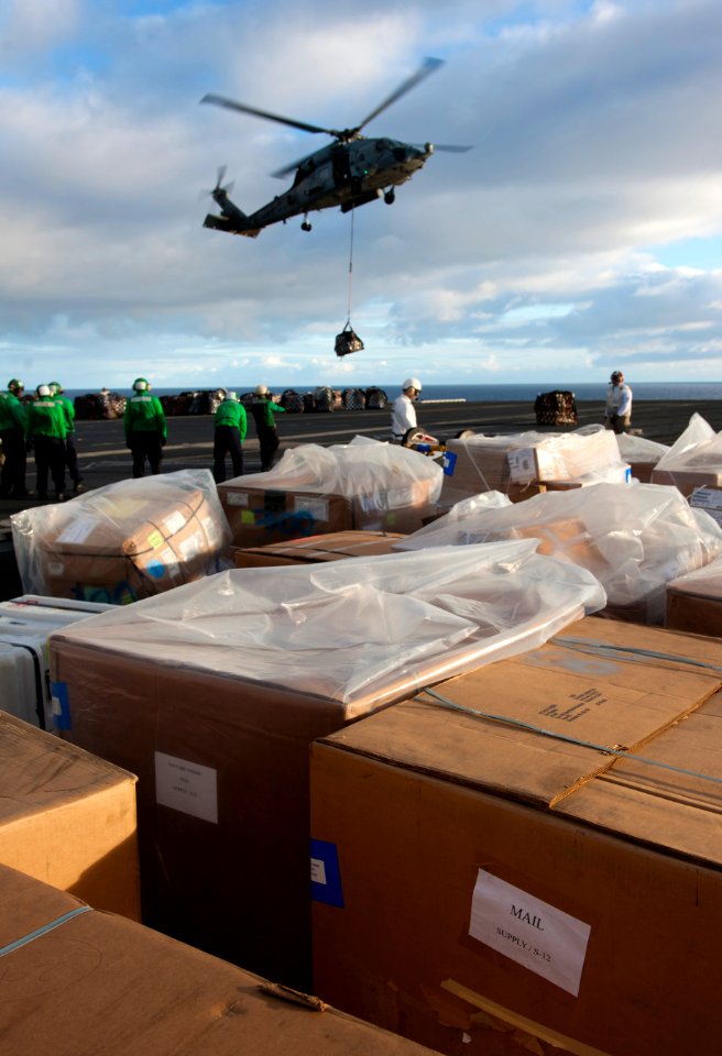 US Navy 101224-N-7981E-612 HH-60H Sea Hawk helicopters assigned to Helicopter Anti-Submarine Squadron (HS) 15 deliver pallets of mail to the aircra
