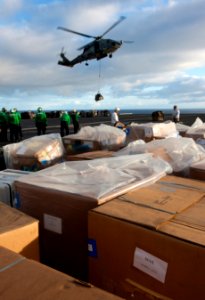 US Navy 101224-N-7981E-612 HH-60H Sea Hawk helicopters assigned to Helicopter Anti-Submarine Squadron (HS) 15 deliver pallets of mail to the aircra
