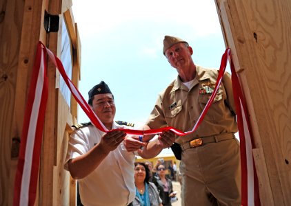 US Navy 101220-N-2984R-438 Cmdr. Mark Becker, mission commander of Southern Partnership Station 2011, right, and Peruvian navy Capitan de Corbeta D photo