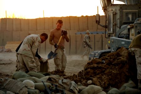 US Navy 101218-N-6436W-191 Active duty and reserve component Seabees assigned to Naval Mobile Construction Battalions 40, 18 and 26 secure and fort