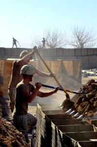 US Navy 101218-N-6436W-113 Active duty and reserve component Seabees assigned to Naval Mobile Construction Battalions 40, 18 and 26 secure and fort