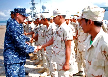 US Navy 102610-N-8539M-473 Chief Damage Controlman Saul Delacruz leads a team of U.S. Sailors as they meet Cambodian sailors before boarding a Roya