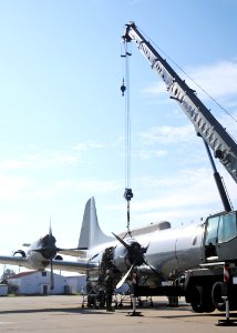 US Navy 110105-N-9564W-172 Seabees assist the crew members of Fleet Air Reconnaissance Squadron (VQ 2) with an engine swap