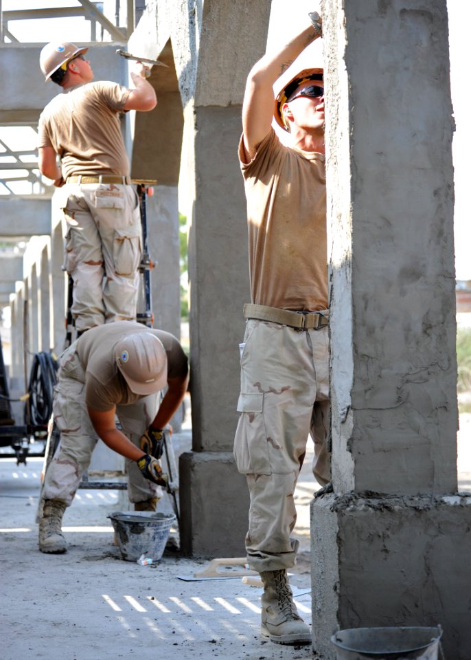 US Navy 110112-N-4440L-009 Seabees apply stucco to the exterior columns of the Ecole 5 primary school construction project
