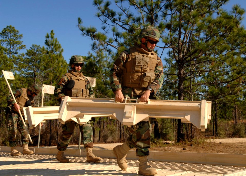 US Navy 110121-N-8816D-033 Seabees assigned to Naval Mobile Construction Battalion (NMCB) 133 disassemble a medium girder bridge during a field tra