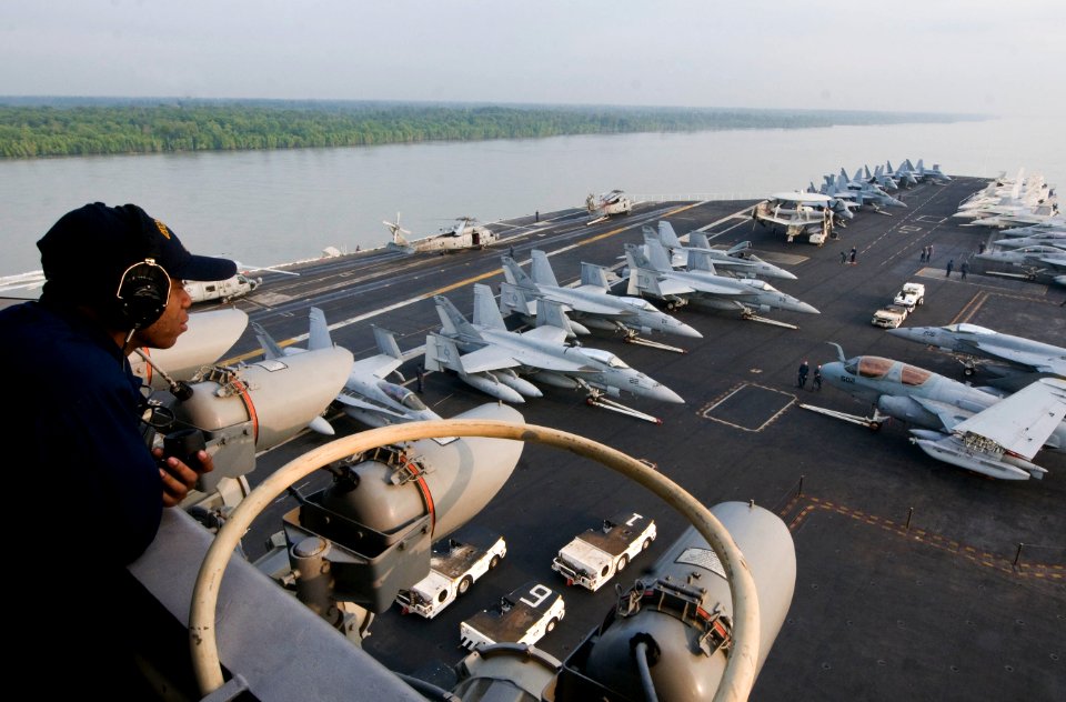 US Navy 110122-N-7488A-394 Quartermaster Seaman Jameel Shaheer stands a lookout watch as the aircraft carrier USS Carl Vinson (CVN 70) pulls into P