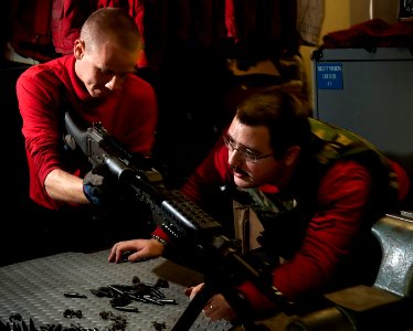 US Navy 101219-N-7981E-159 Sailors conduct a general weapons instruction on an M-240 machine gun