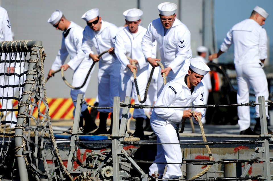 US Navy 110201-N-7498L-217 Sailors assigned to the guided-missile frigate USS Reuben James (FFG 57) secure mooring lines as the ship gets underway