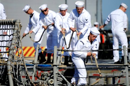 US Navy 110201-N-7498L-217 Sailors assigned to the guided-missile frigate USS Reuben James (FFG 57) secure mooring lines as the ship gets underway