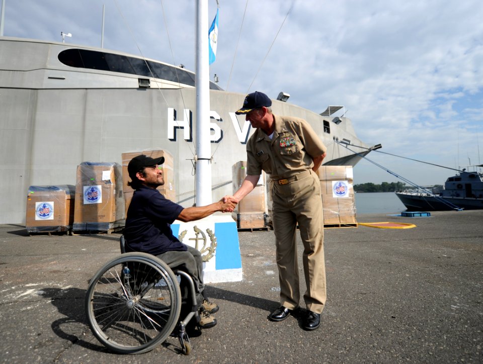 US Navy 110121-N-2984R-079 Cmdr. Mark Becker, mission commander of Southern Partnership Station 2011, greets Omar Cruz, Guatemala