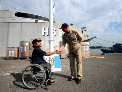 US Navy 110121-N-2984R-079 Cmdr. Mark Becker, mission commander of Southern Partnership Station 2011, greets Omar Cruz, Guatemala photo