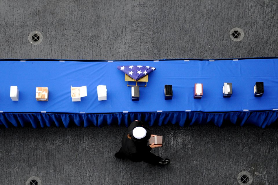 US Navy 101227-N-8040H-977 Aviation Ordnanceman 3rd Class Rebecca Lyons participates in a burial at sea aboard USS Carl Vinson (CVN 70)
