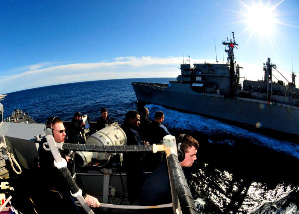 US Navy 110122-N-9811S-055 Sailors on the bridge of the guided-missile destroyer USS Barry (DDG 52) monitor a refueling at sea with the Military Se