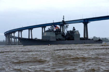 US Navy 101222-N-9643K-503 The guided-missile cruiser USS Princeton (CG 59) passes under the Coronado Bridge as the ship returns from a deployment