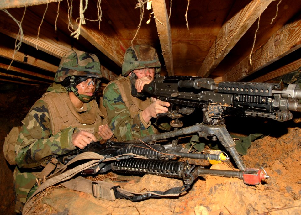 US Navy 110125-N-8816D-061 Seabees assigned to Naval Mobile Construction Battalion (NMCB) 133 man an M240B 7.62 mm machine gun in their fighting p