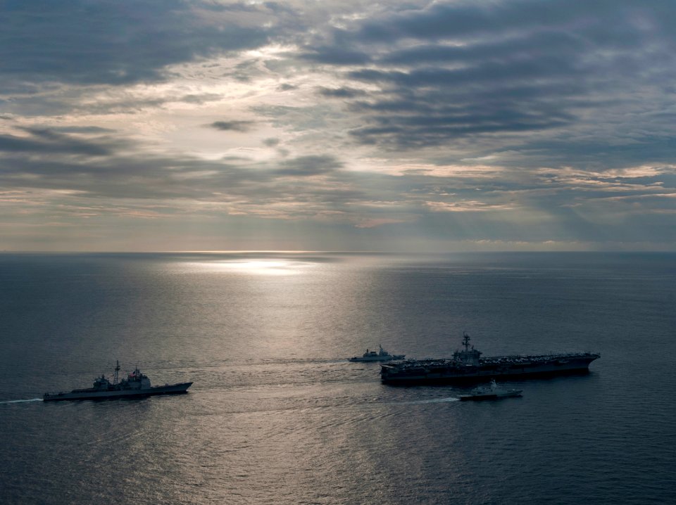 US Navy 110126-N-7981E-142 he Nimitz-class aircraft carrier USS Carl Vinson (CVN 70) leads a formation of ships