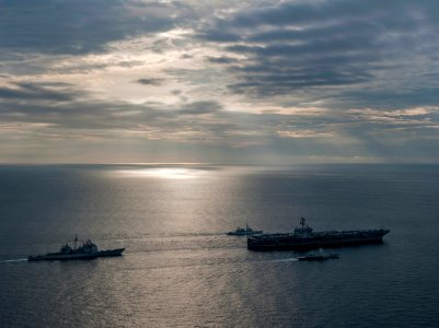 US Navy 110126-N-7981E-142 he Nimitz-class aircraft carrier USS Carl Vinson (CVN 70) leads a formation of ships