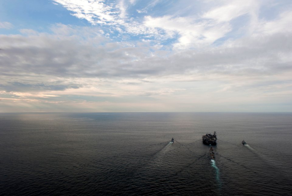 US Navy 110126-N-7981E-171 he Nimitz-class aircraft carrier USS Carl Vinson (CVN 70) leads the Royal Malaysian Navy frigate KD Lekir (FF 26) and co