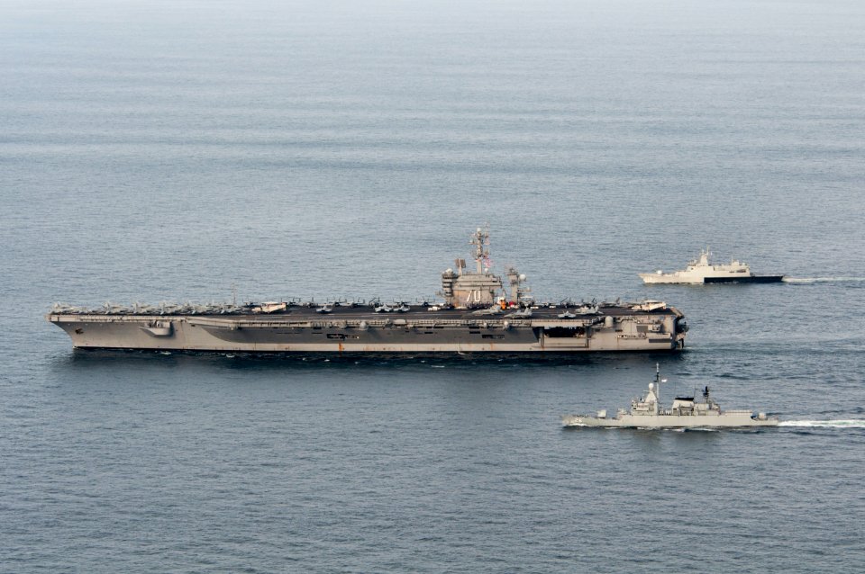 US Navy 110126-N-7981E-385 The Nimitz-class aircraft carrier USS Carl Vinson (CVN 70) leads the Royal Malaysian Navy frigate KD Lekir (FF 26) and c