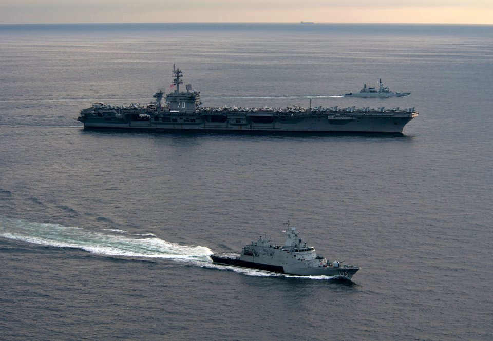 US Navy 110126-N-7981E-582 The Royal Malaysian Navy corvette KD Kelantan (FFL 175) and frigate KD Lekir (FF 26) pull away from the Nimitz-class air