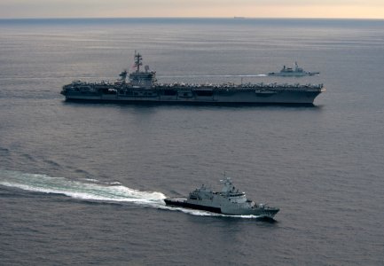 US Navy 110126-N-7981E-582 The Royal Malaysian Navy corvette KD Kelantan (FFL 175) and frigate KD Lekir (FF 26) pull away from the Nimitz-class air