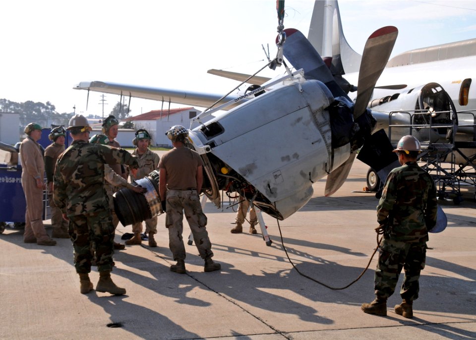 US Navy 110105-N-9564W-139 Seabees assist the crew members of Fleet Air Reconnaissance Squadron (VQ 2) with an engine swap