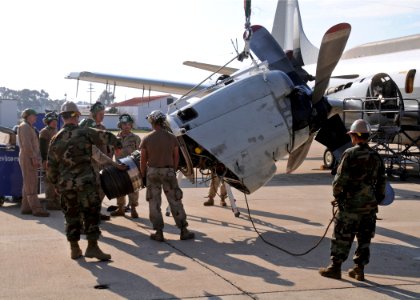 US Navy 110105-N-9564W-139 Seabees assist the crew members of Fleet Air Reconnaissance Squadron (VQ 2) with an engine swap