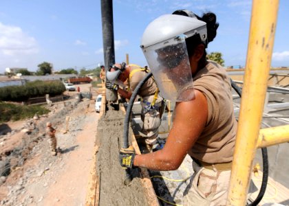 US Navy 110120-N-4440L-075 Builder Constructionmen Diana Aceves, right, and Daniel Fuentes, both assigned to Naval Mobile Construction Battalion (N photo
